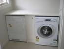 Custom built laundry with front loader washing machine