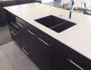 Island with Corian benchtop and Heritage Eco-granite sink